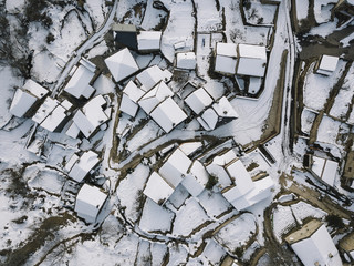Aerial view of a small village after a heavy snowfall in Guadalajara,  Spain