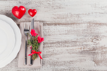 Rustic table setting with thyme and cyclamen flowers