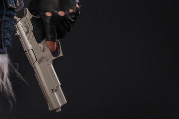 Close up of sexy girl with gun in hand
