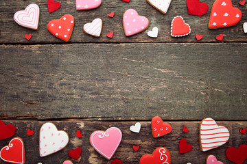 Homemade valentine cookies on wooden table