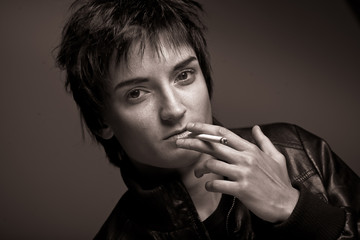 young woman smoking. close up