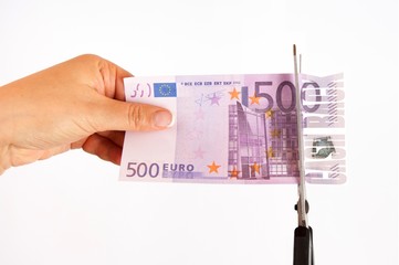Concept of cash back. The scissors cut banknote 500 euros inscription cash back