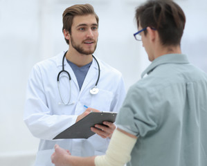 doctor writes a recommendation for the patient.