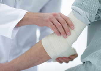 closeup.doctor applying elastic bandage