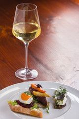 Glass of wine and snack.