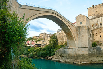 Fototapeta na wymiar Mostar bridge with river in old town. Bosnia and Herzegovina