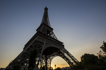 Obraz na płótnie Canvas Eiffel Tower at sunset in Paris, France. Romantic travel background.