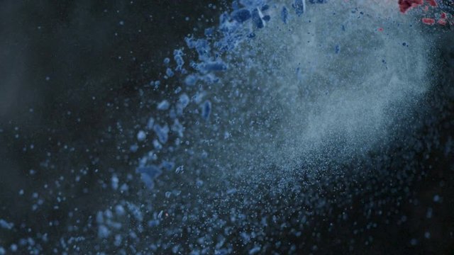 Colorful powder/particles fly after being throwed