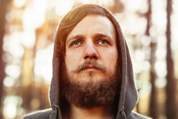 portrait hipster tourist man with beard and tourist in the woods forest