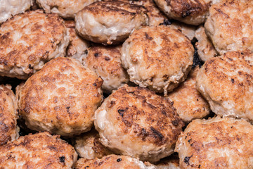 lots of fried chops in a frying pan, homemade Russian cuisine, food background