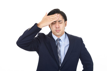 頭痛に悩む男性