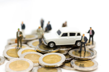 Miniature person: Businessman standing on stack of coins. Image use for business, financial concept.