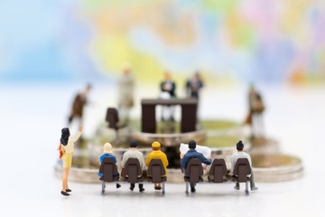 Miniature people: Recruiter interview applicants. Image use for background Choice of the best suited employee, HR, HRM, HRD, job recruiter concepts.