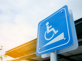 disabled ramp sign in the gas station parking.