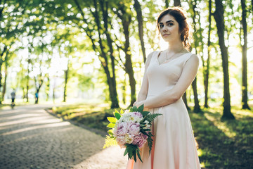 Attractive young woman enjoying her time outside in park