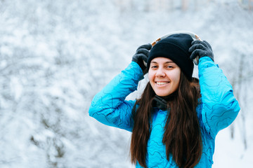 Fototapeta na wymiar young woman walk in snowy day with headset