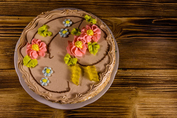 Kiev cake with cream on wooden table. Top view