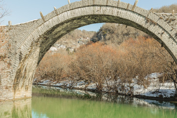 bridge old in Ioannina Zagori Greeece snow ice winter time