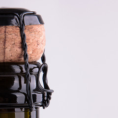 The neck of a bottle of champagne close up