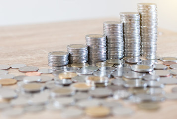 Saving money concept preset by Male hand putting money coin stack growing business