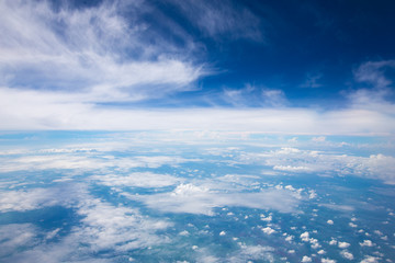 Fototapeta na wymiar Vast of cloudy and bluesky background. View from airplane.
