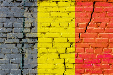 Belgian flag painted on an old brick wall