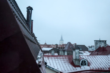 Fototapeta na wymiar Oldtown Roofs During the Fog and Drizzle in Tallinn