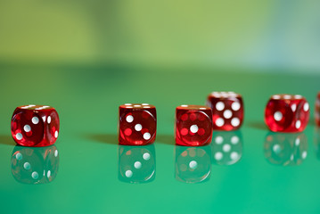playing poker dice on green background