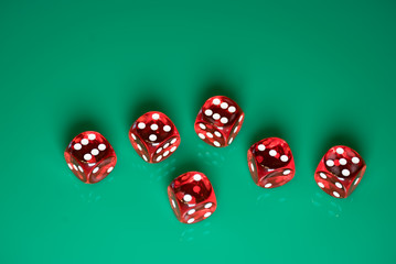 playing poker dice on green background