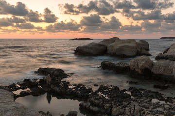 Fototapeta na wymiar Water stones evening long exposure shot