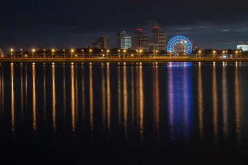 Fototapeta na wymiar view of night city reflecting in the water