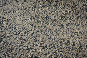 Pouring ready-mixed concrete by mixing mobile the concrete mixer. Texture concrete mixing of...