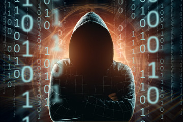 Hacker in the hood, hacker attack, silhouette of the man, mixed media. The concept of a sudden attack, cryptography, data security.