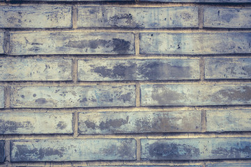 ancient grey grunge brick wall background .