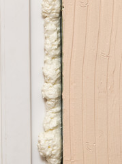 Fixing the gap in the door with construction foam