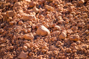 Red clay soil on nature as a background