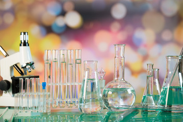Science laboratory research and development concept. microscope with test tubes