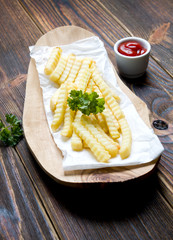 French fries on dark wood
