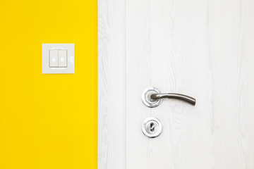 Electricity switch in a bright orange wall