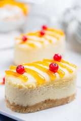 Fresh aromatic cake cheesecake on a white plate.