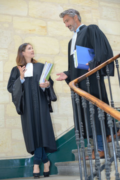 attorneys talking while walking