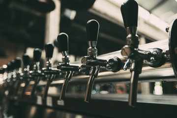 Row of Beer Taps in Pub