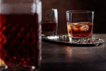 Glass of scotch whiskey and natural ice .