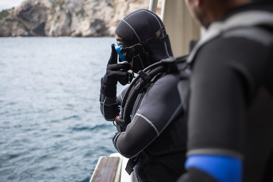 Scuba Diver Preparing On Boat