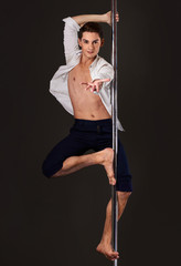 Male pole dancer with stage look posing for fashion magazine cover