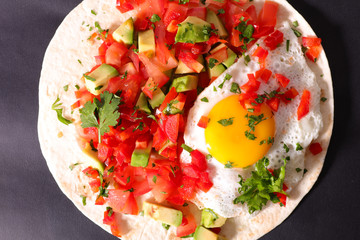 pita bread with tomato,bell pepper, avocado and egg