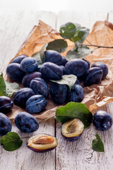 Plums on table
