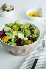 Fresh salad with vegetables tomatoes, cucumbers, lettuce, salad leaves and eggs. Healthy food and diet concept. Vegetarian food.
