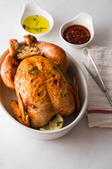  Roasted chicken with garlic, lemon, thyme and rosemary.