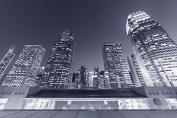 Modern office building and skyline of Hong Kong City at night